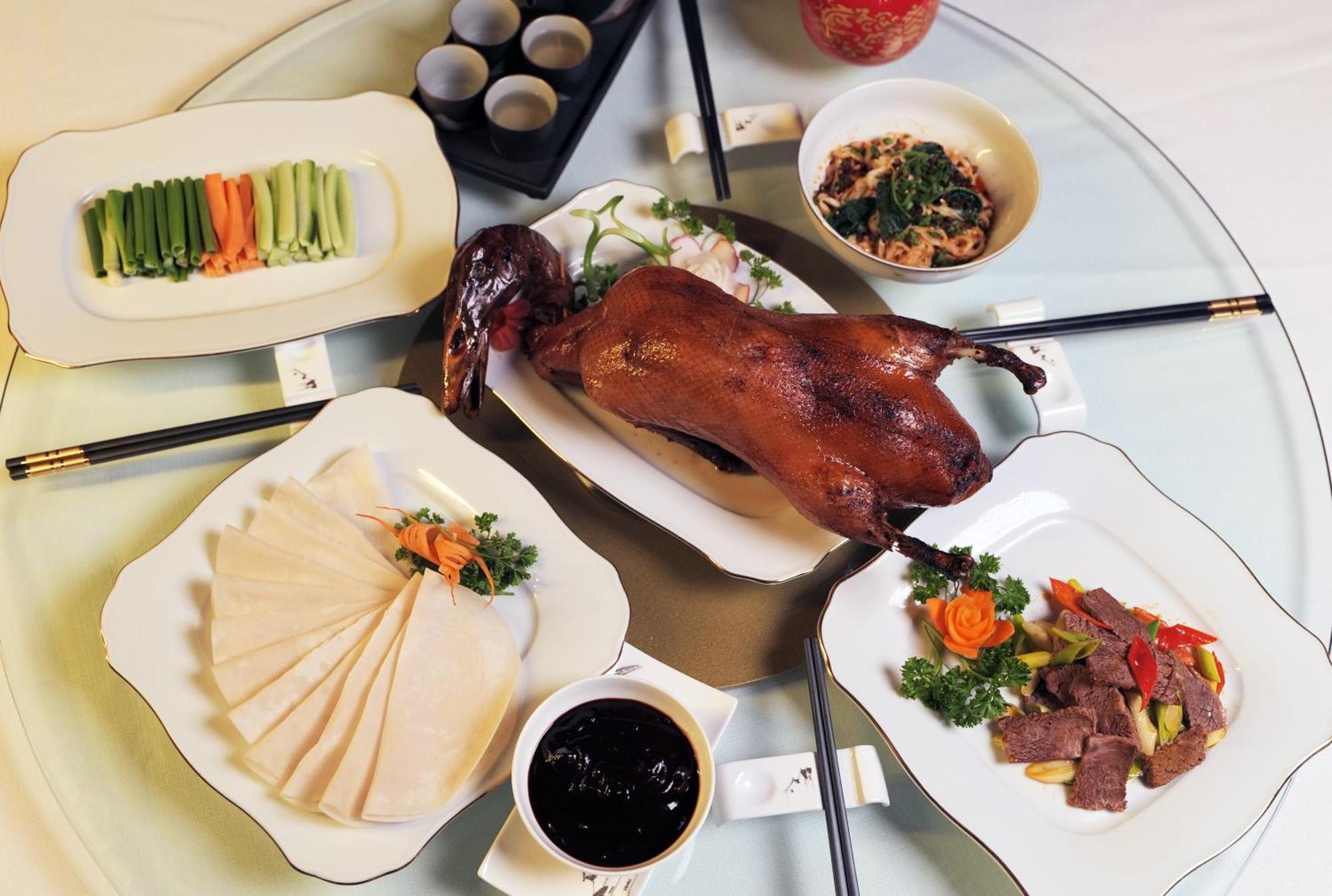 Beijing Palace Soluxe Hotel Astana Exterior foto A selection of dishes prepared with duck